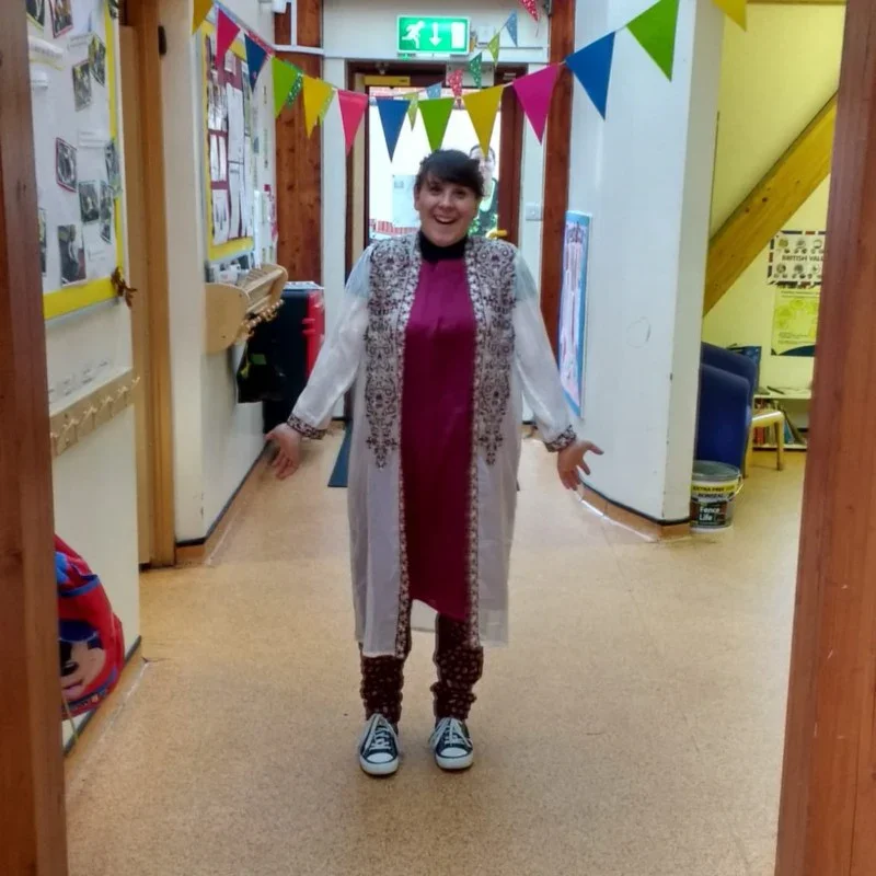 Elena Zidar smiling in a school hallway